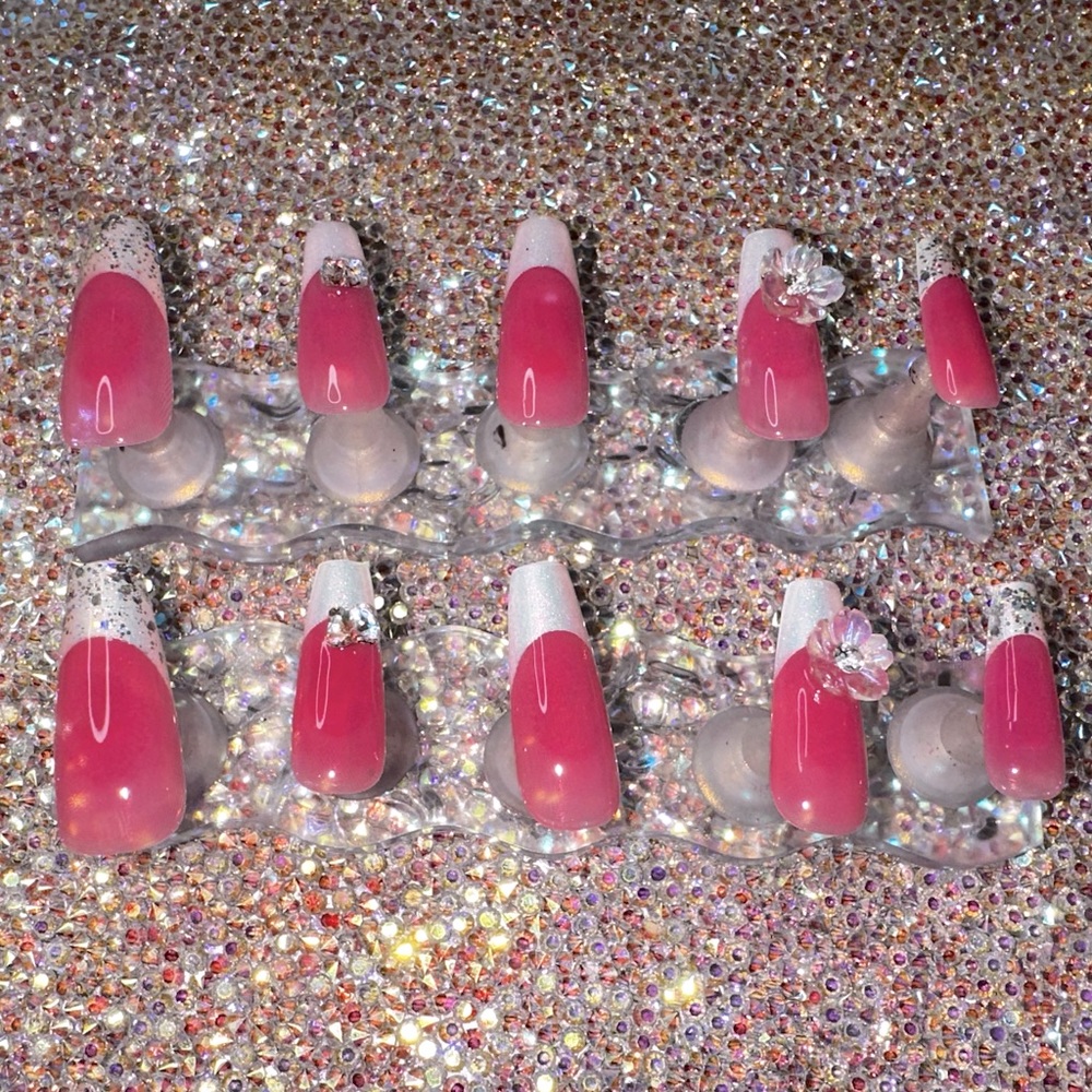 Pink and white aura blush nails with glitter and butterfly charms and flowers!